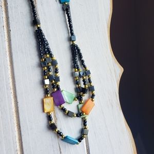 Beautiful colorful necklace. Maybe hematite.